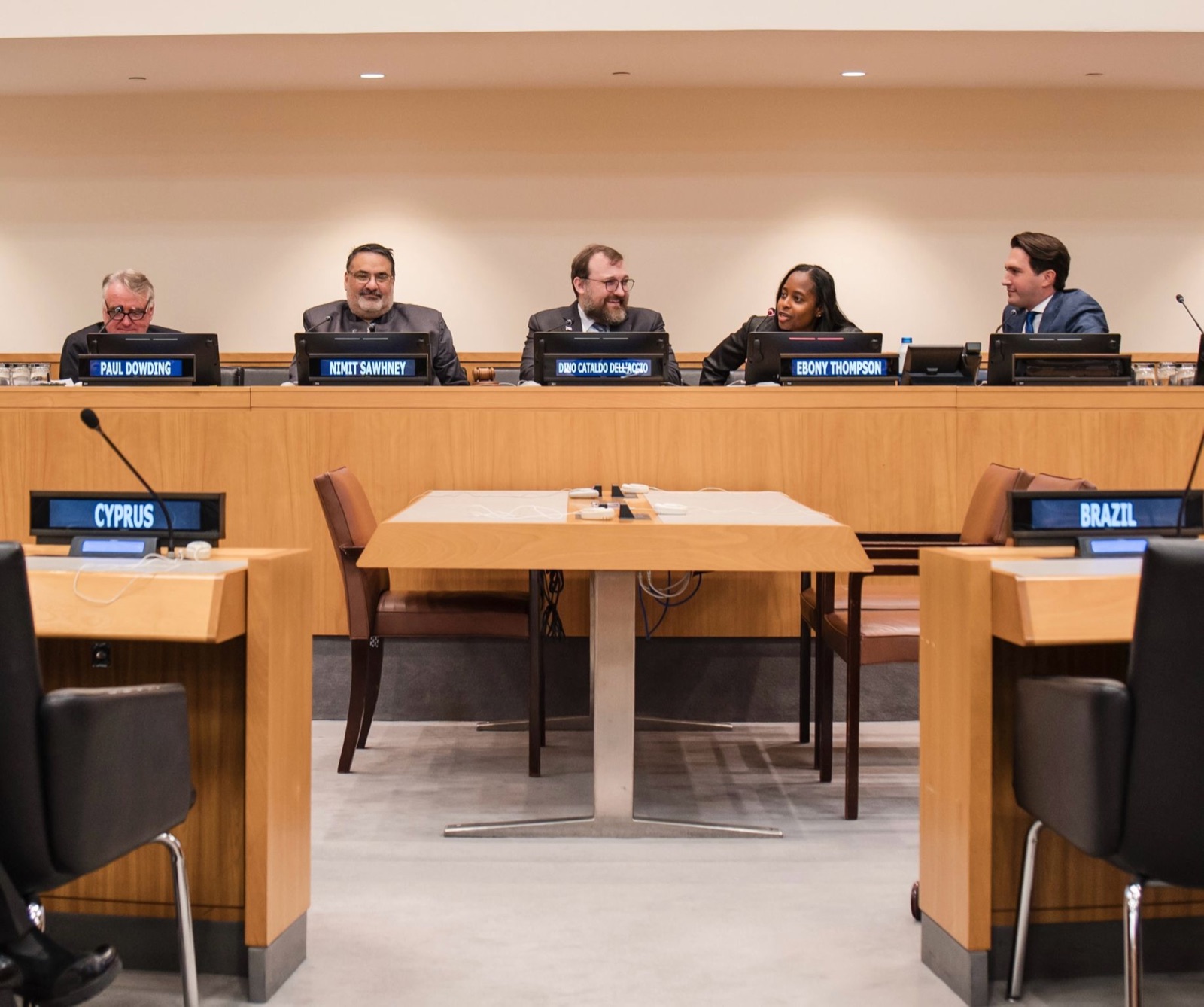 Paul Dowding, Nimit Sawhney, Charles Hoskinson, Ebony Thompson and J. Tennyson Singer seated at the panel table in a United Nations conference room